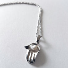 Hamsa with a Pearl Necklace